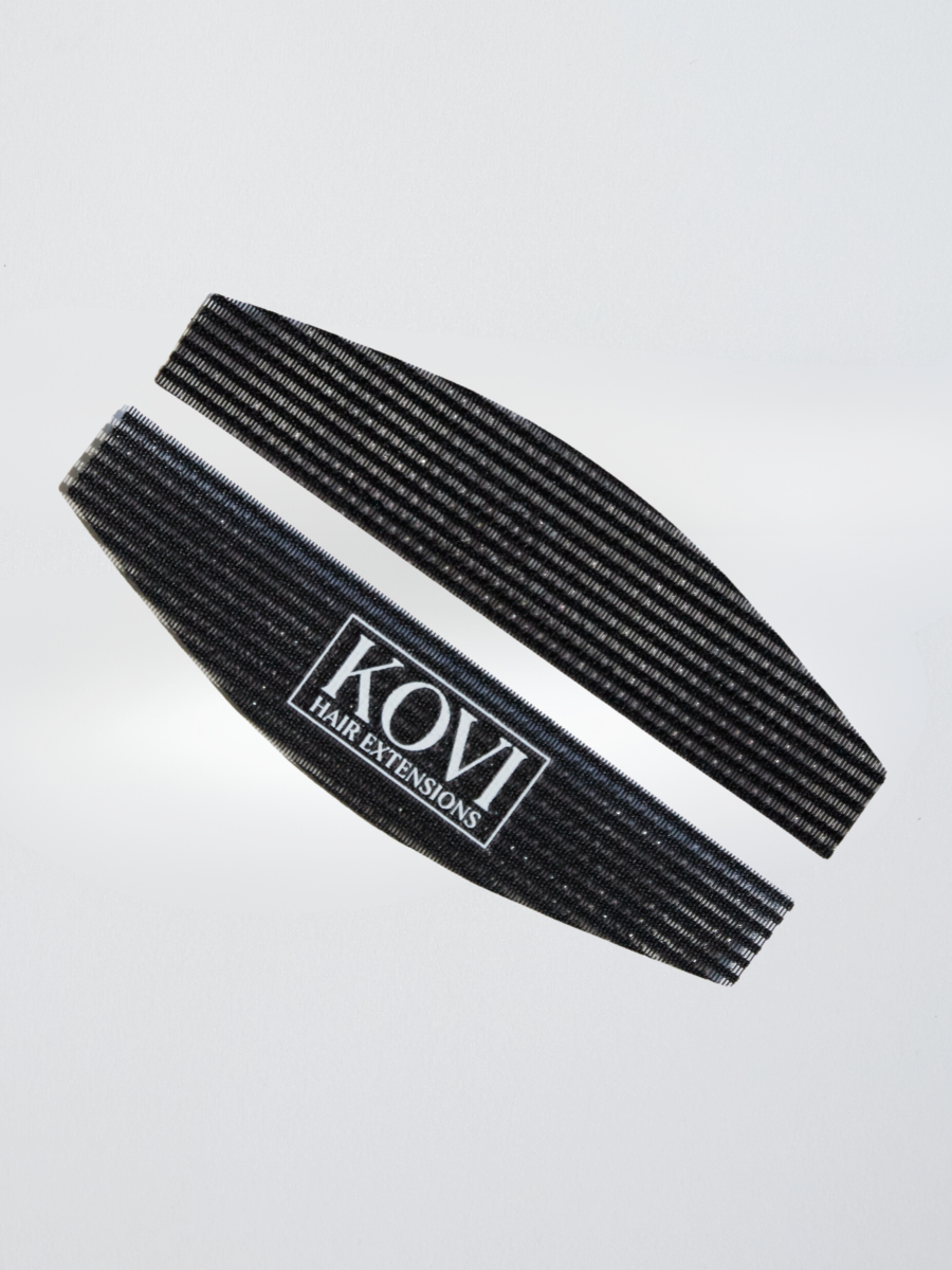 KOVI curved hair grippers, an essential tool for professional hair stylists working with extensions. The curved design follows the natural shape of the head, ensuring a firm hold for clean, precise sectioning.