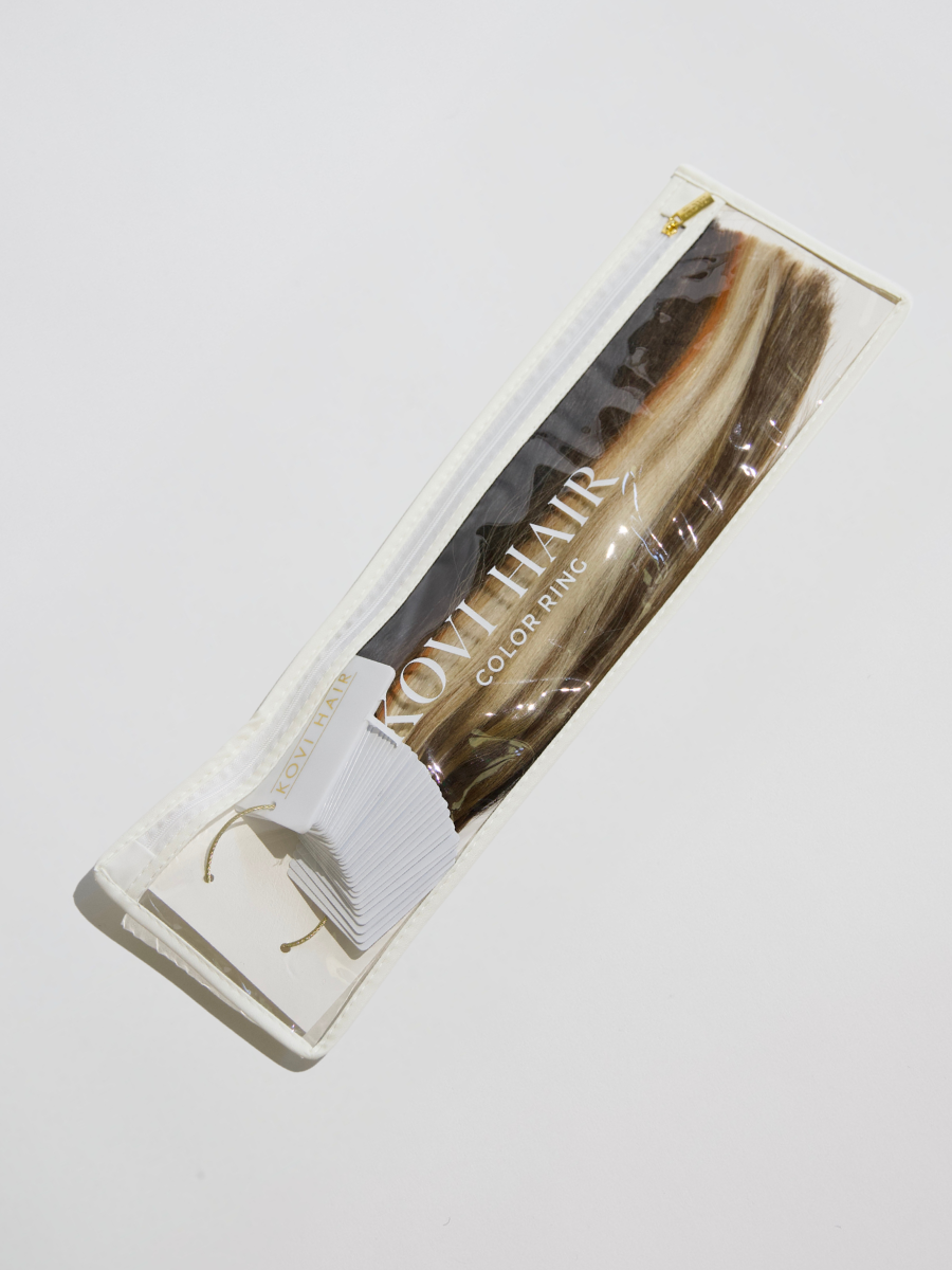  A KOVI Hair extension color ring stored in a sleek, protective bag. The bag keeps the high-quality human hair swatches organized and secure, ensuring easy access for seamless color matching. Perfect for stylists and professionals looking for a convenient way to compare and select the perfect extension shade.