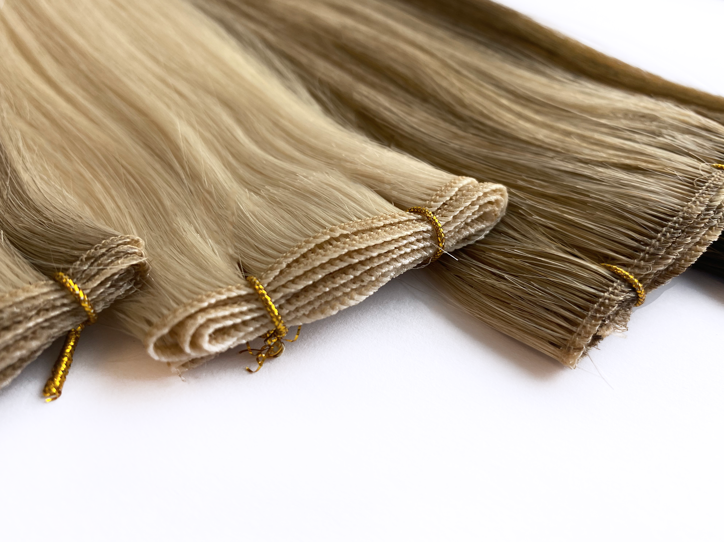 Close up of KOVI mircowefts. made form 100% cuticle aligned professional remy human hair extensions