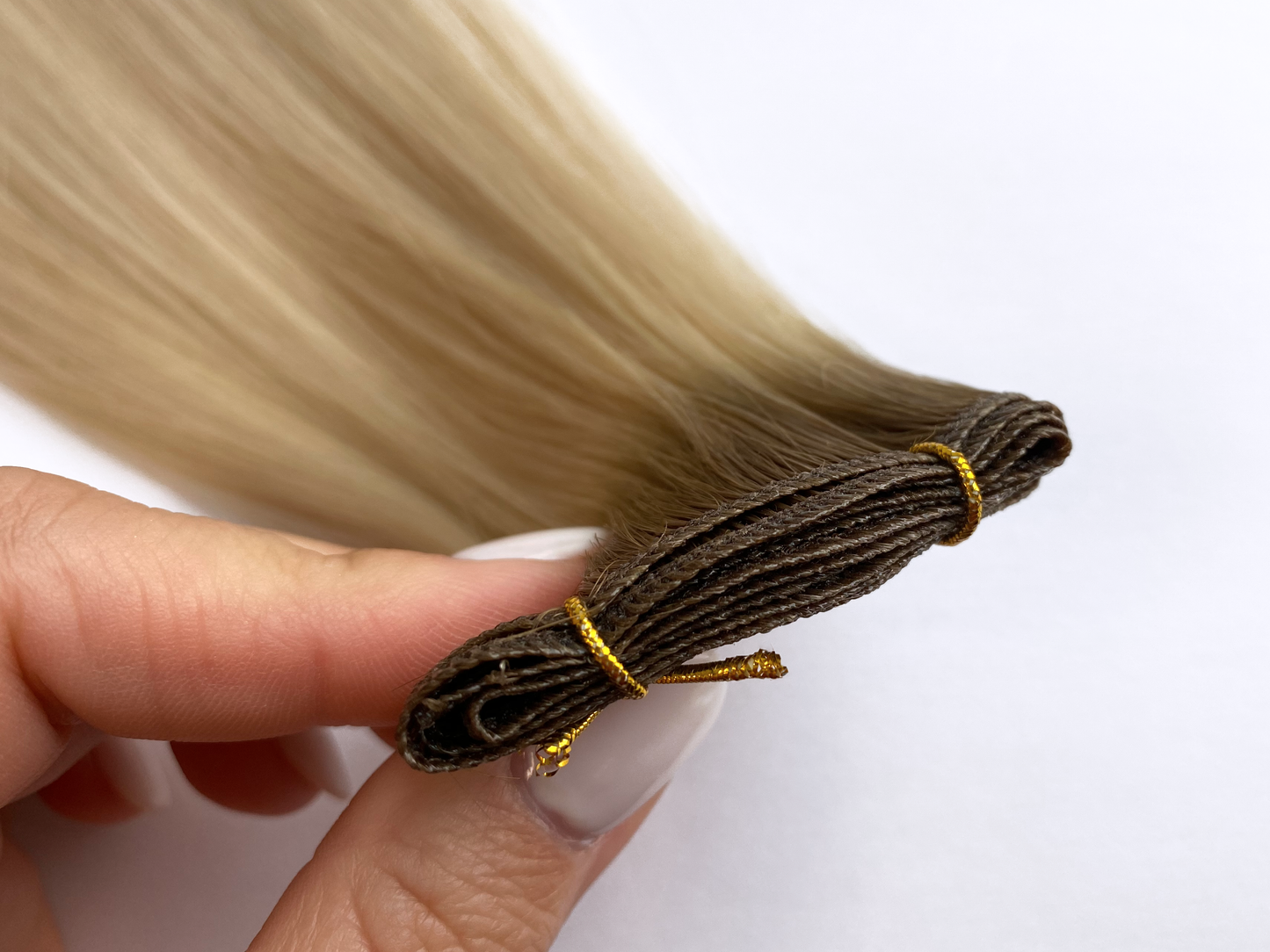 100% remyhuman hair micro weft hair extension with a brown root. 